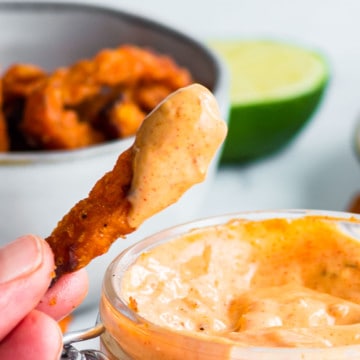 Dipping a sweet potato fries into freshly made Chipotle Mayo Dip.