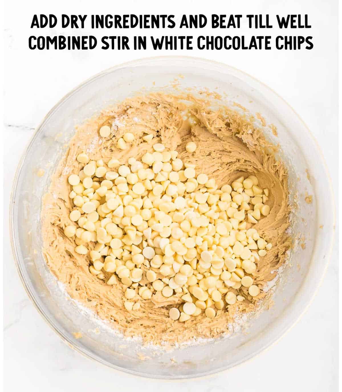 stirring white chocolate chips into the batter