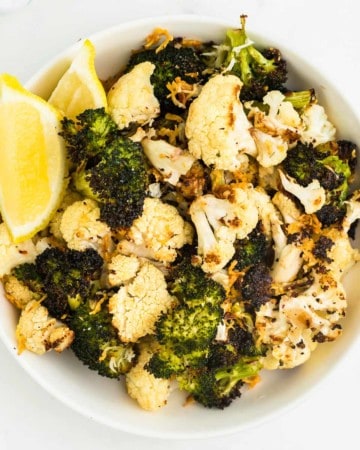 closeup of a bowl of roasted broccoli and cauliflower