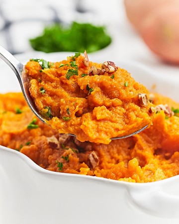 Closeup of a serving bowl of Mashed Sweet Potatoes.