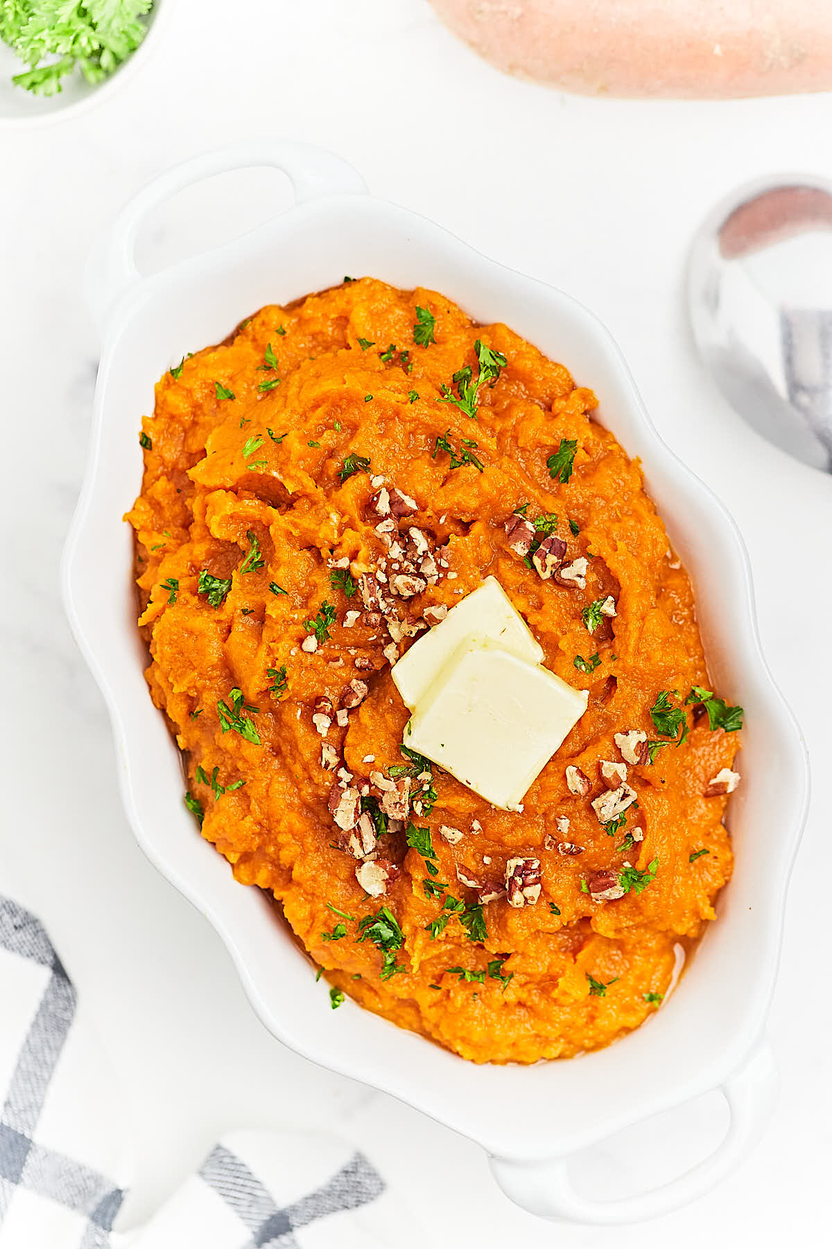Top-down view of a serving bowl filled with Mashed Sweet Potatoes.