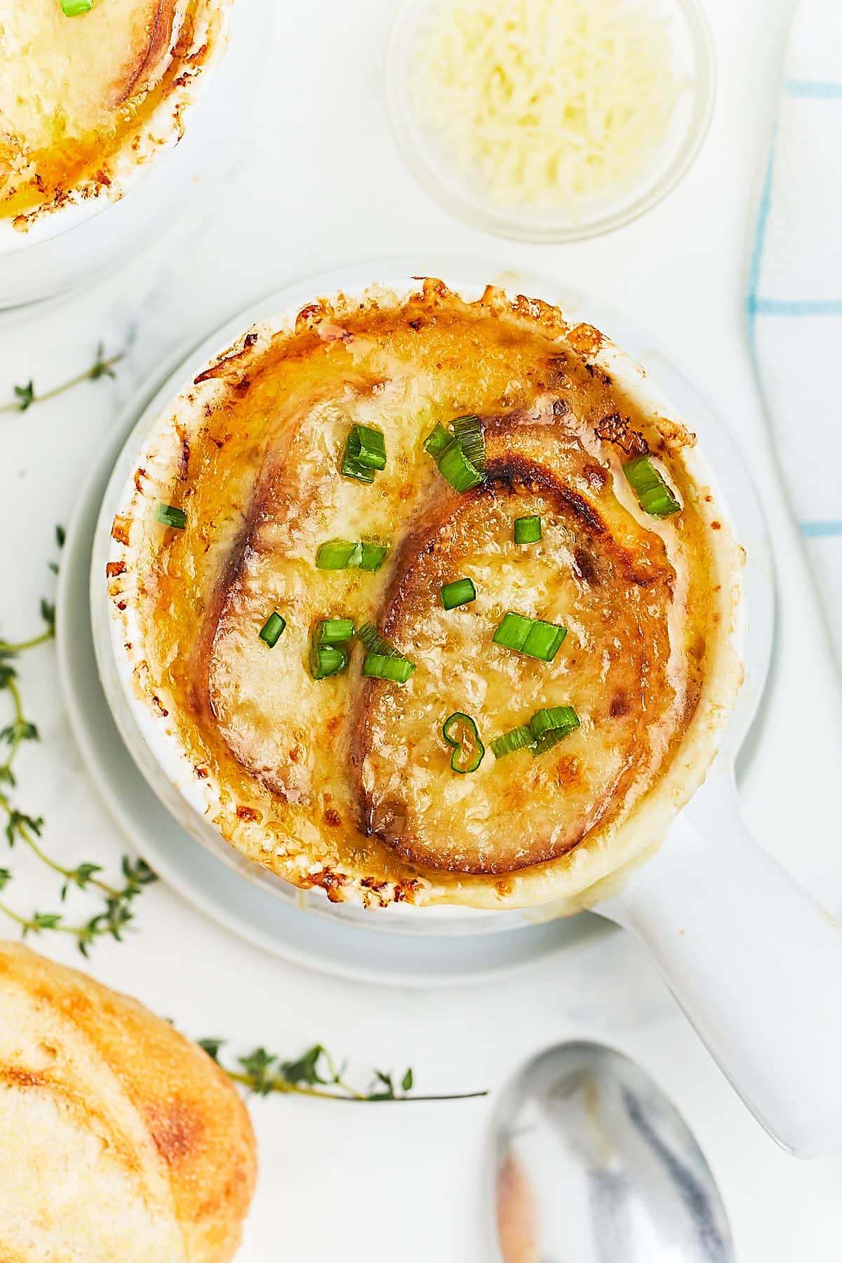 French Onion soup served in a white bowl.