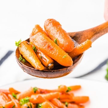 a spoonful of hot glazed candied carrots