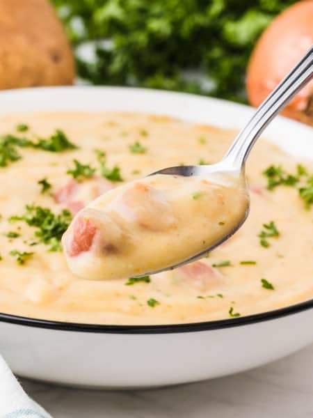 Creamy German Potato Soup in a white bowl.
