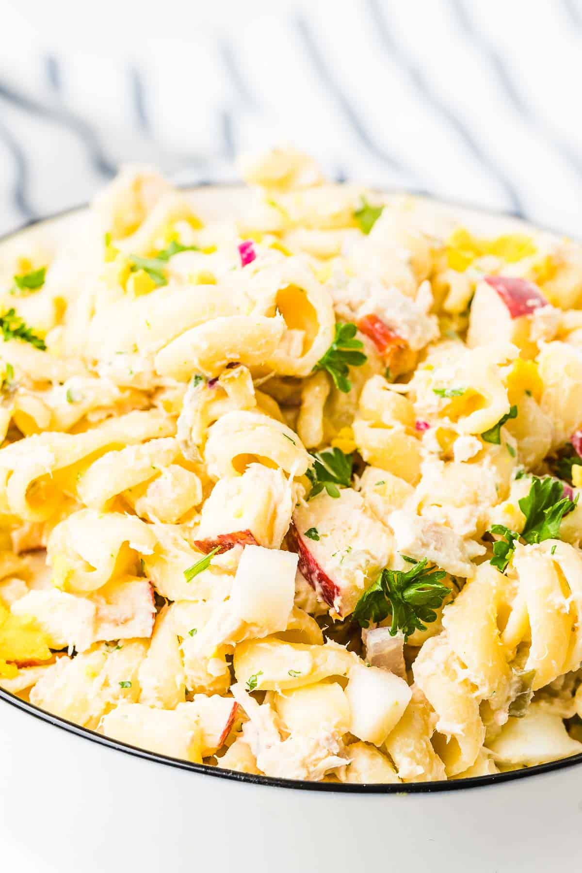 Sweet and savory Tuna Pasta Salad in a white bowl. 