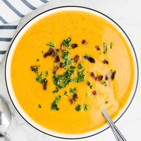 Butternut Squash Soup in a bowl with a spoon.
