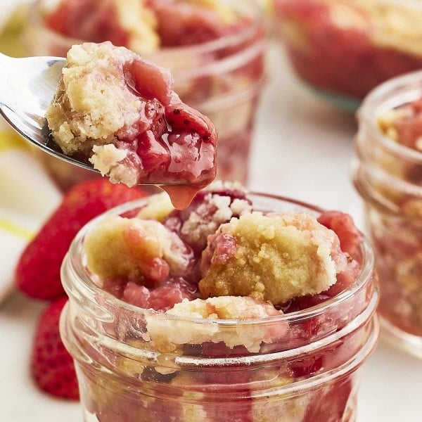 Strawberry Dump Cake served in mason jars.