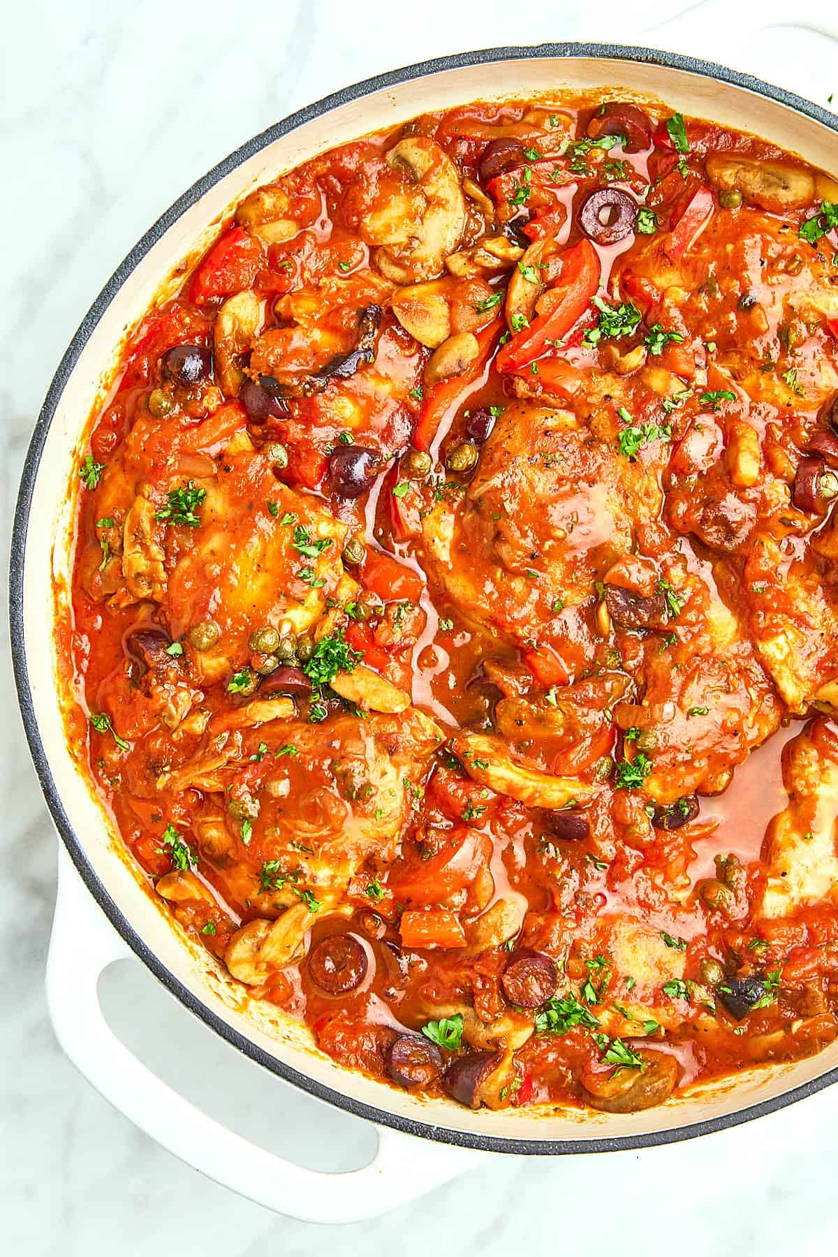 Top down view of a skillet with Chicken Cacciatore.