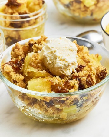 Pineapple Dump Cake served in a glass bowl.