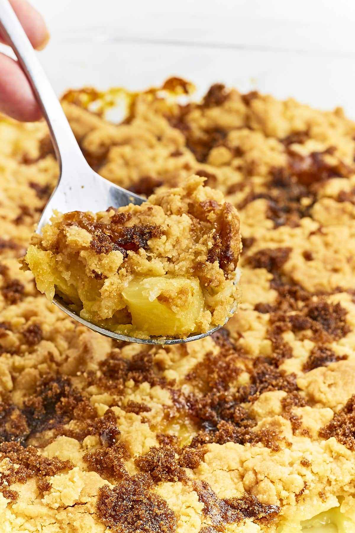 A spoonful of freshly baked Pineapple Dump Cake.