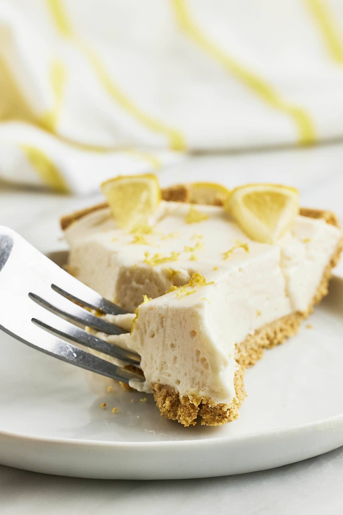 Digging into a slice of Lemon Cheesecake.