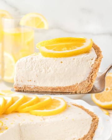 A slice of no-bake Lemon icebox pie on a serving plate.