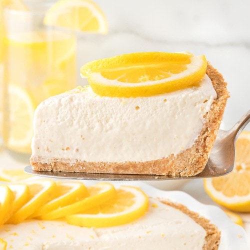 A slice of no-bake Lemon icebox pie on a serving plate.
