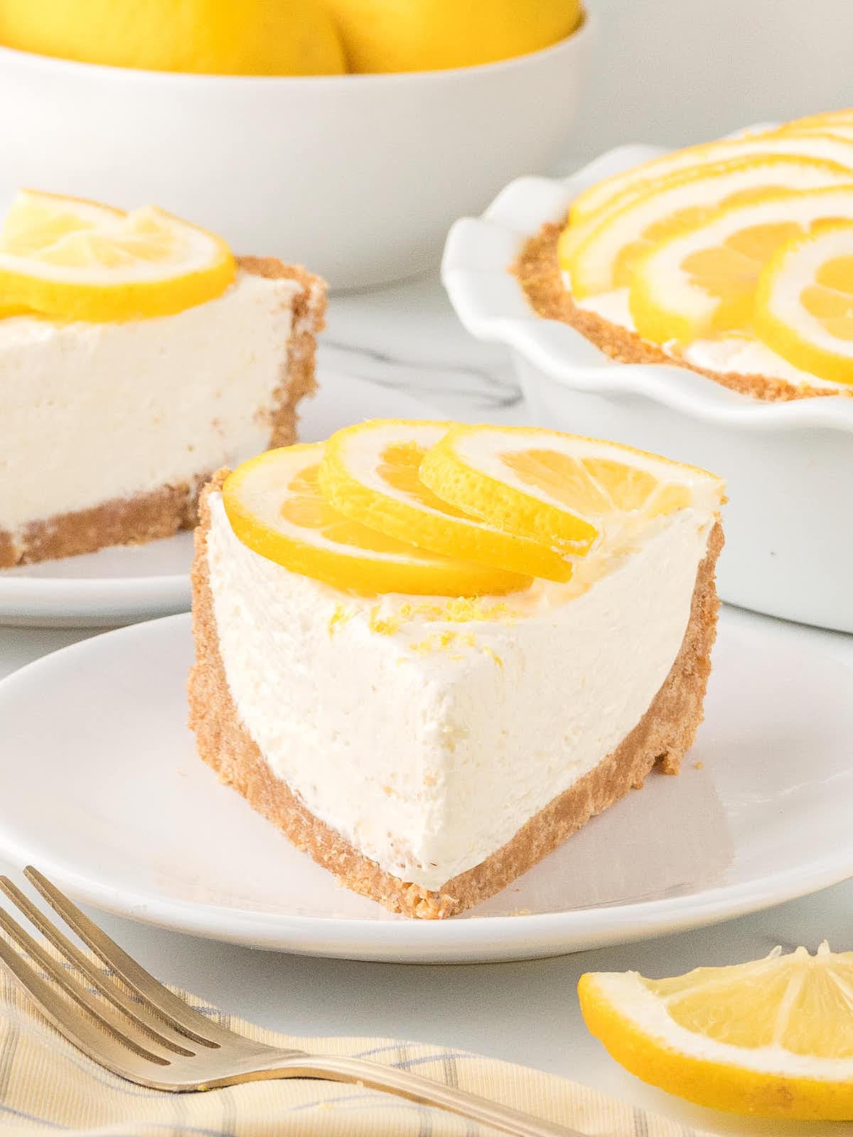 A slice no-bake Lemon Icebox Pie on a white plate.