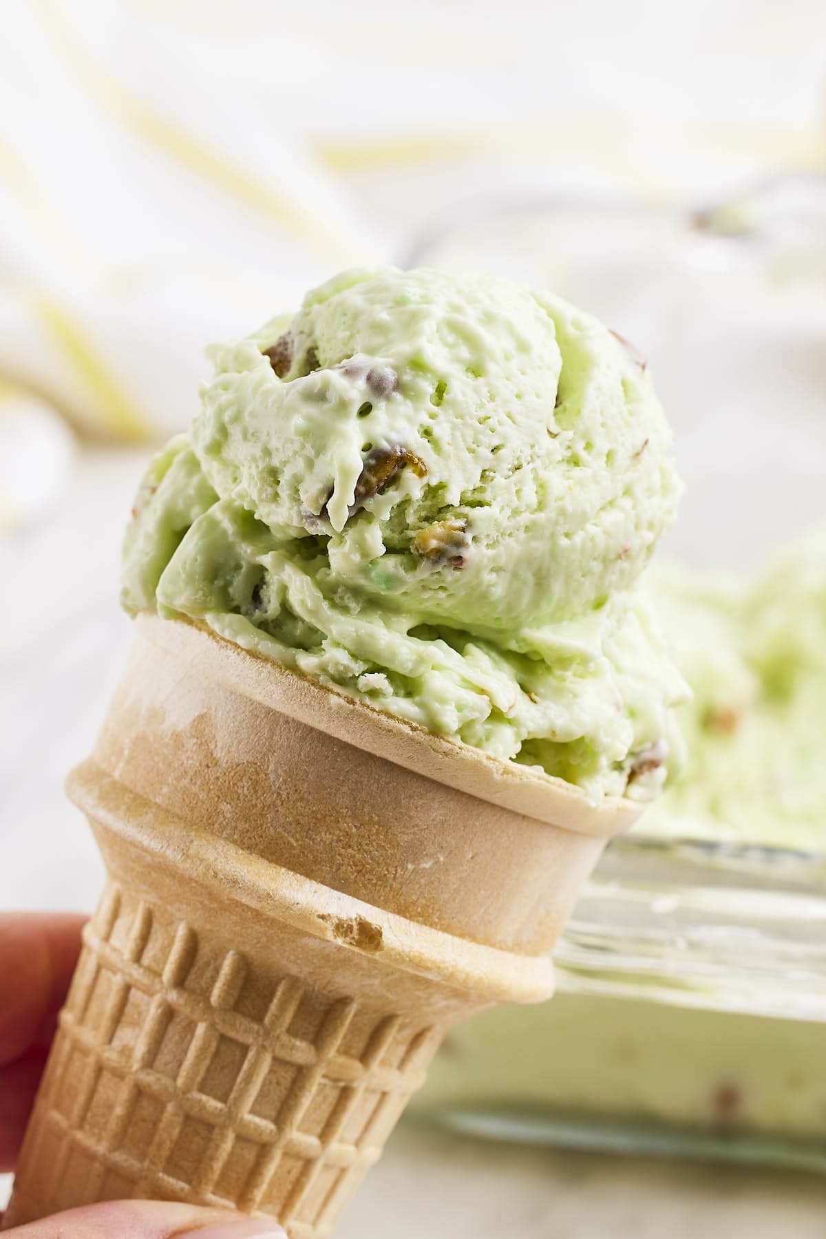 No-churn Pistachio Ice Cream in a cone. 