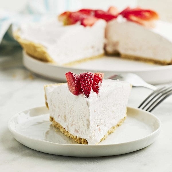 No bake Strawberry Chiffon Pie on a white plate.