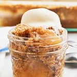 Closeup of an Apple Spice Dump Cake served with a scoop of vanilla ice cream.