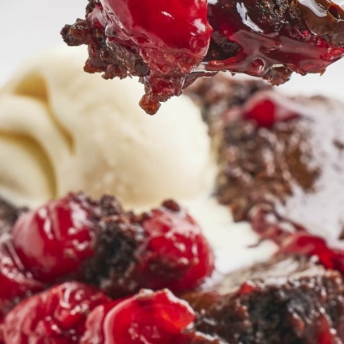 Closeup of a forkful of Black Forest Dump Cake.
