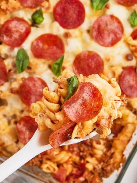 Closeup of a scoop of a cheesy Pizza Casserole.