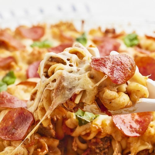 Closeup of a scoop of a cheesy Pizza Casserole.