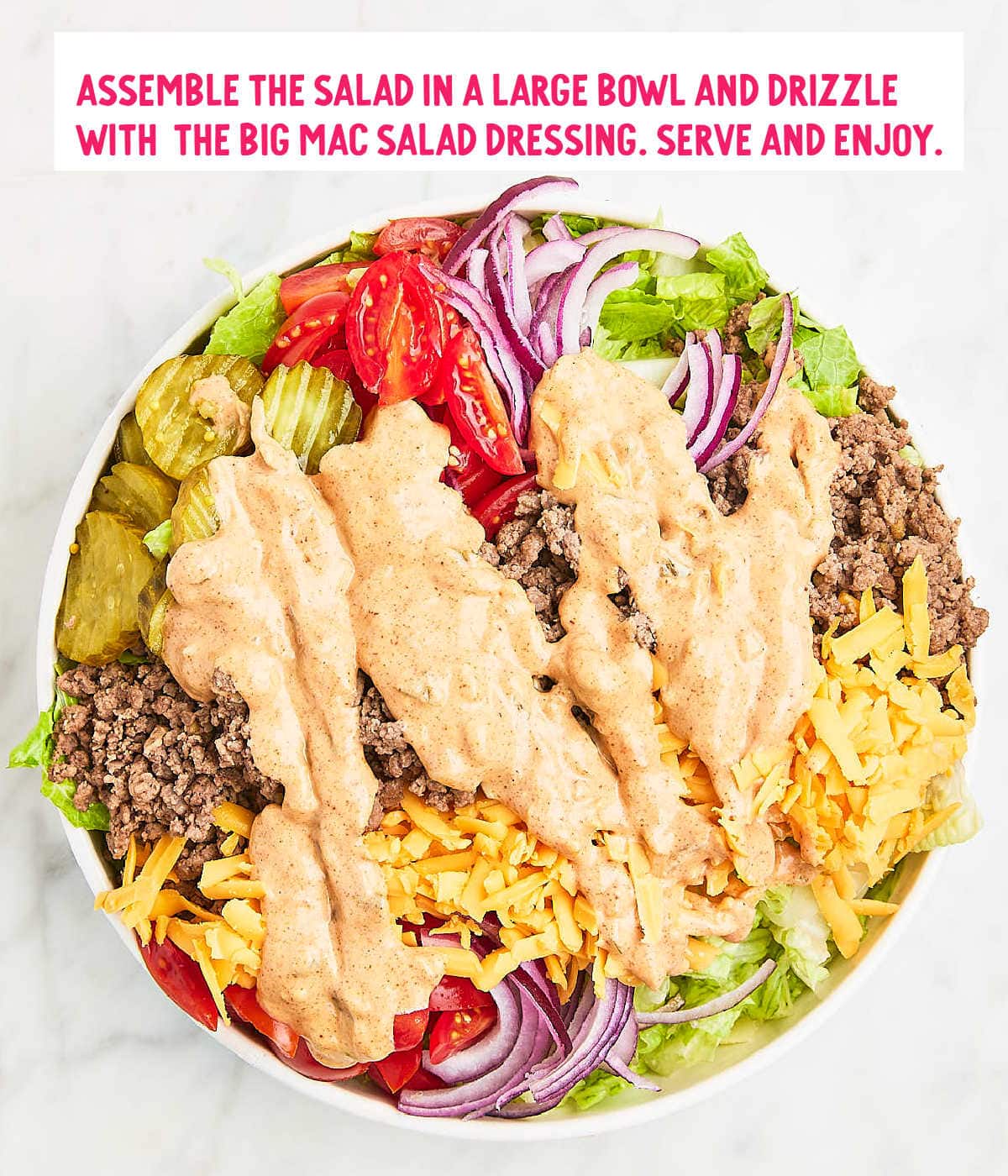 Image of the assembled salad with the drizzled Big Mac Salad Dressing.