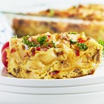 Closeup of a Breakfast Lasagna on a white plate.