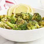 Closeup of Roasted Frozen Broccoli in a white bowl.