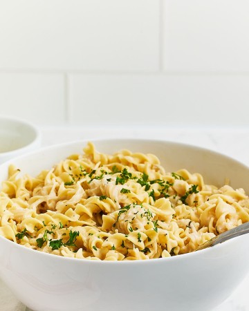 Freshly cooked French Onion Pasta in a large white serving bowl.