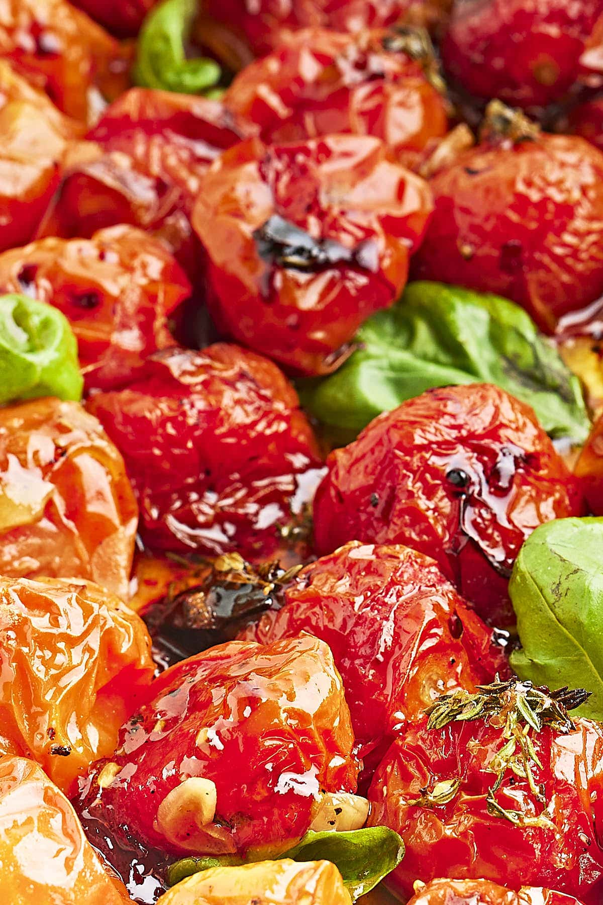 Closeup of a baking sheet full of Roasted Cherry Tomatoes.