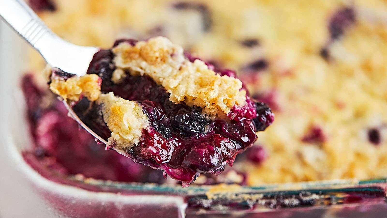 A spoonful of freshly baked Blueberry Dump Cake.