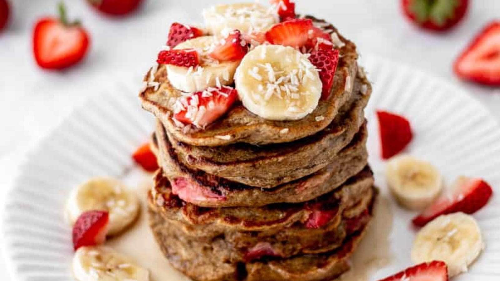 Strawberry Banana Pancakes recipe by Haute Healthy Living.