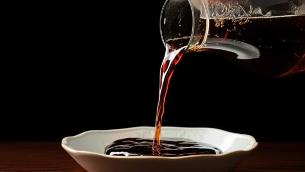 Pouring liquid into a bowl.