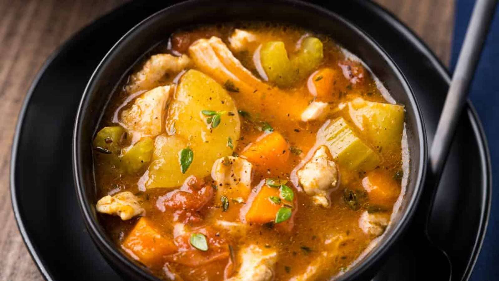 A bowl of stew made with chicken.