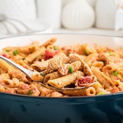 Closeup of Cajun Chicken Pasta in a blue skillet.