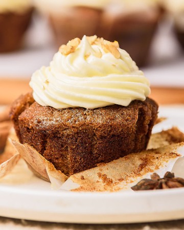 Carrot Cake Cupcake served on a white plate.