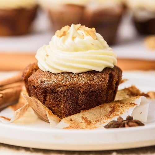 Carrot Cake Cupcake served on a white plate.