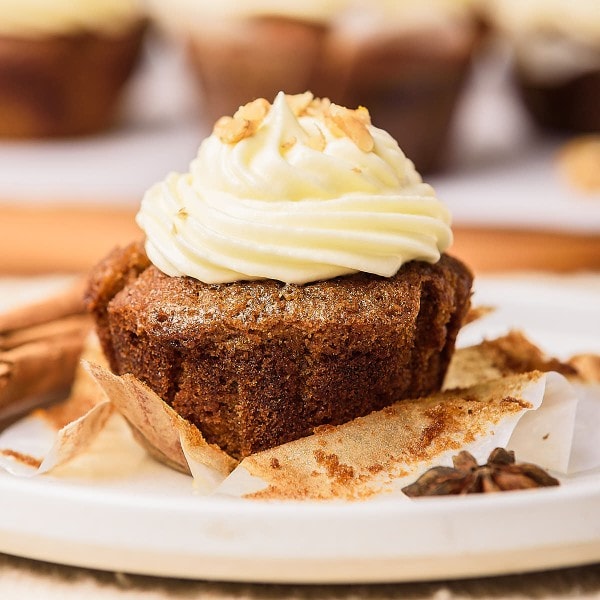 Carrot Cake Cupcake served on a white plate.