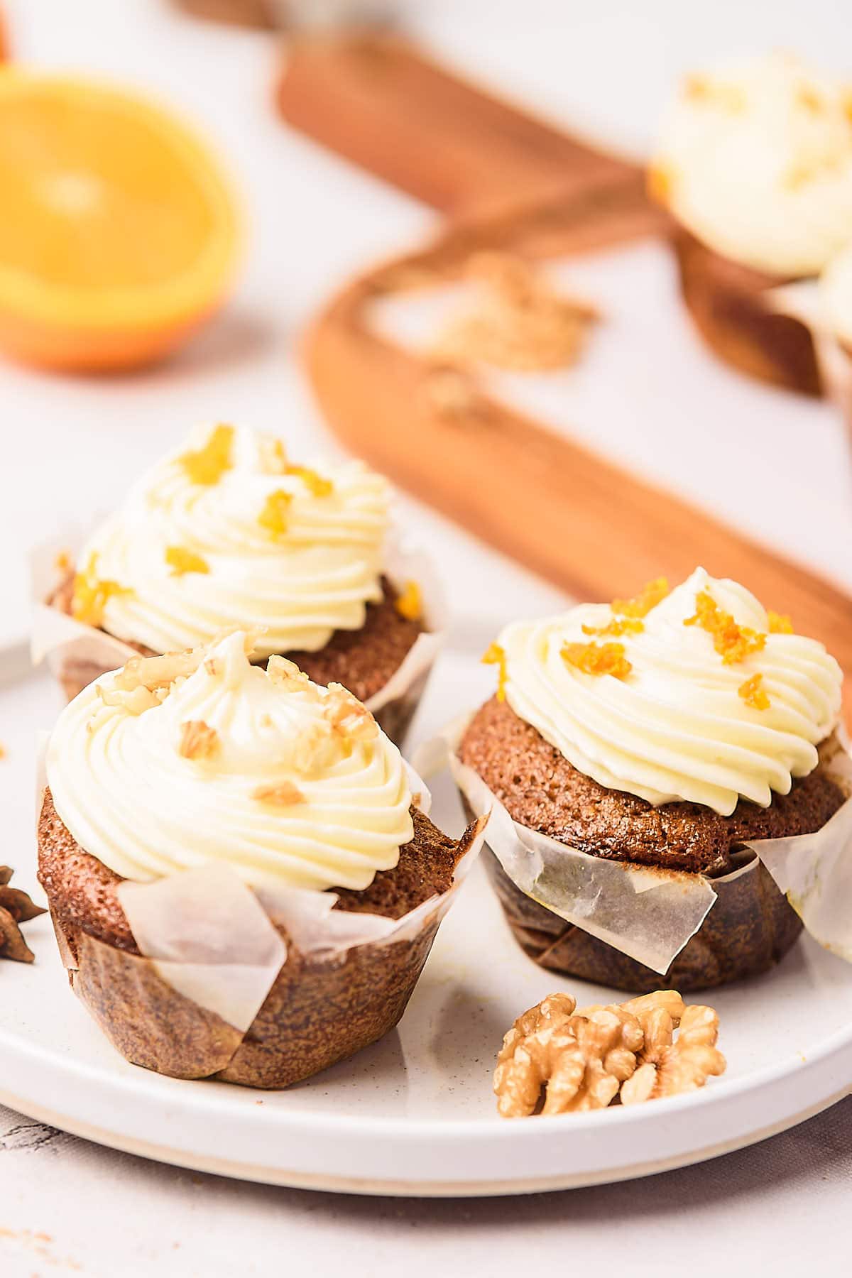 Carrot Cake Cupcakes served on a white plate.