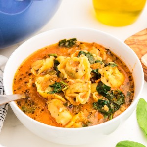 Tortellini Soup in a white bowl.