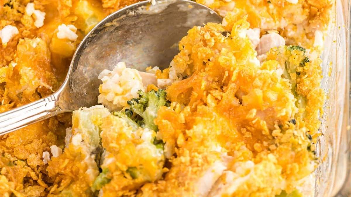 Chicken and broccoli casserole in a casserole dish with a spoon.