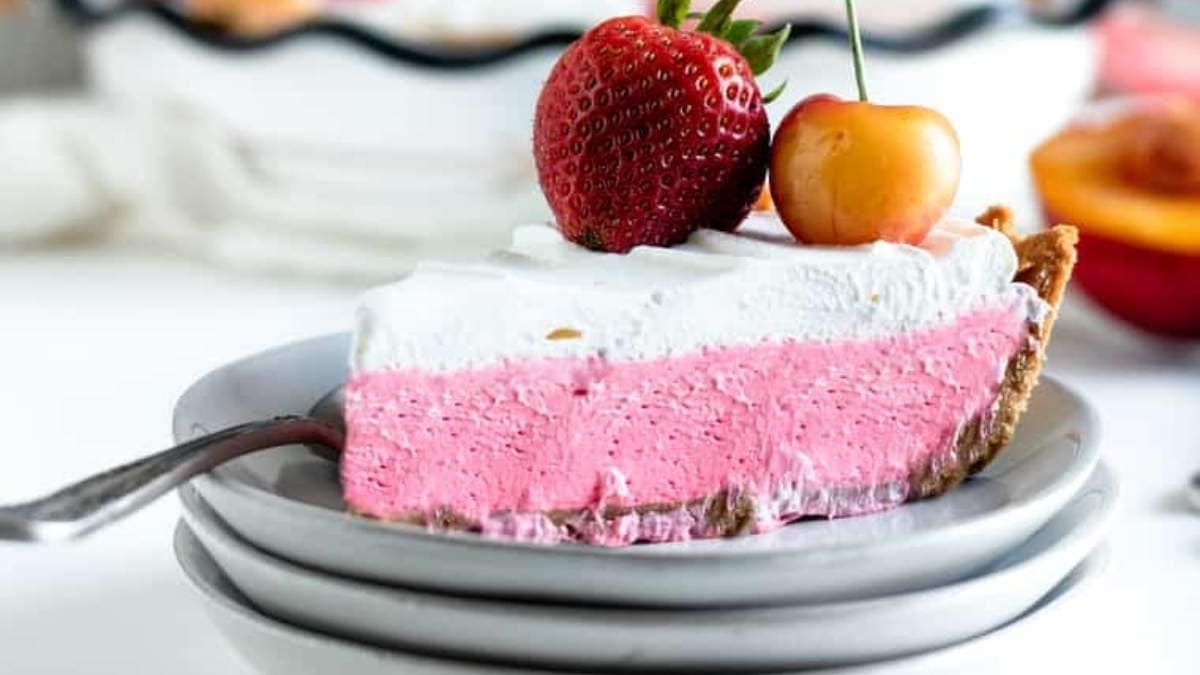 A refreshing slice of strawberry ice cream pie on a plate, perfect for those who love no-bake desserts.