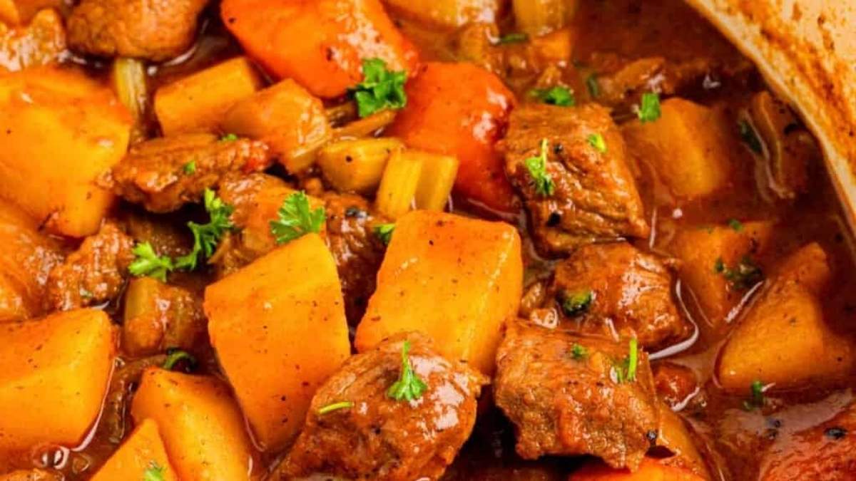 Stew with meat and potatoes in a pot.