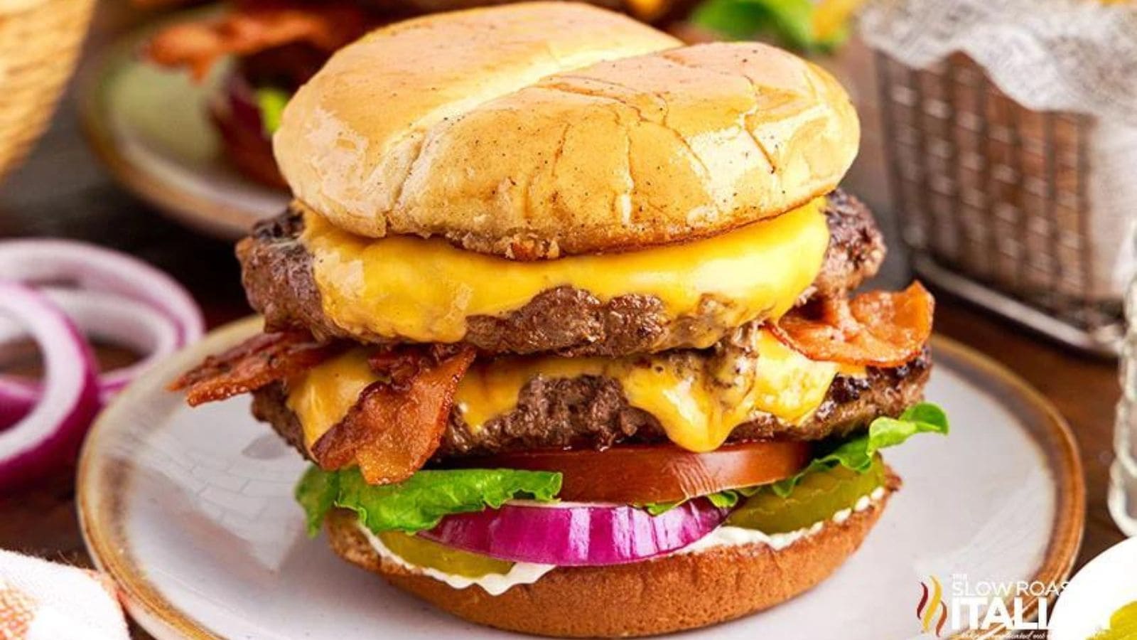 A burger with two patties, bacon and cheese.