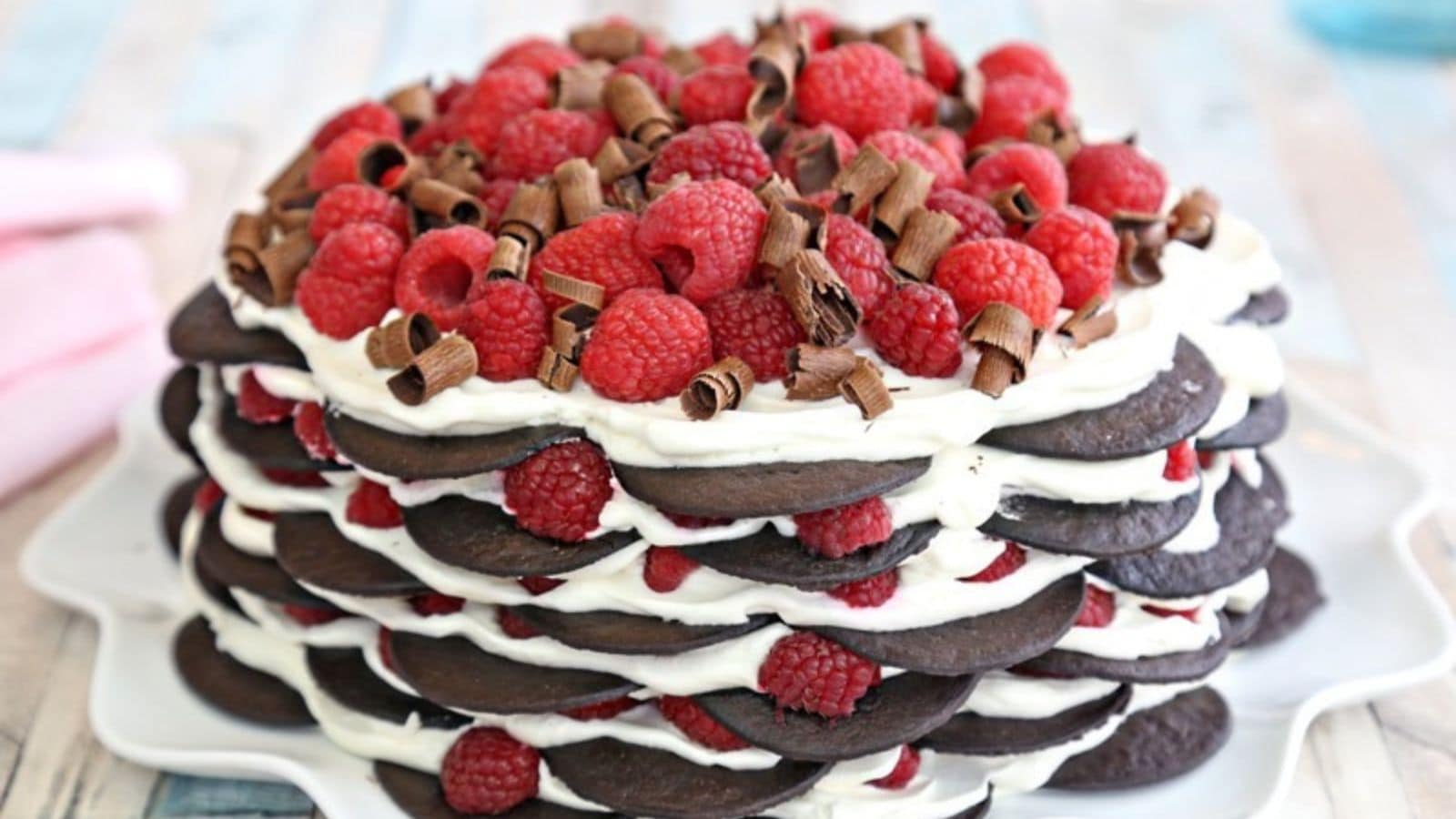 Layers of chocolate cookies, raspberries, and whipped cream.