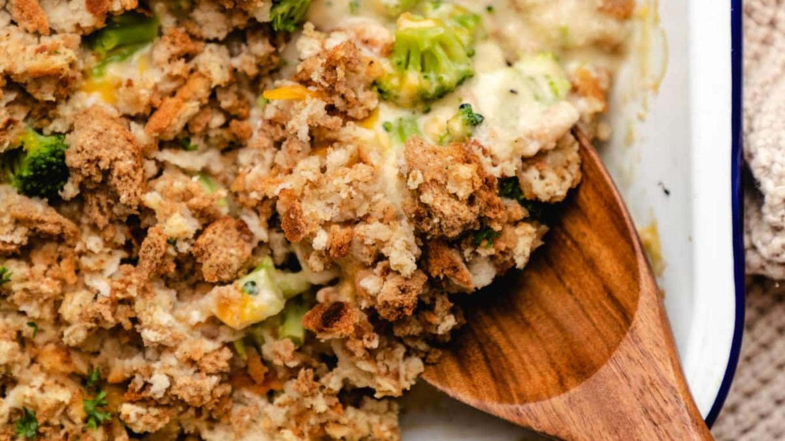 A chicken casserole dish filled with broccoli and stuffing.
