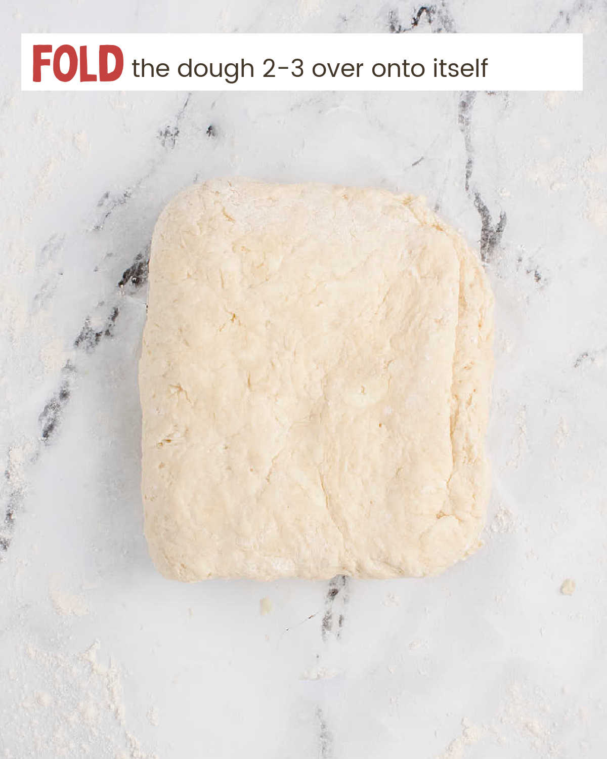 Fold the Air Fryer Biscuits dough over onto a piece of marble.