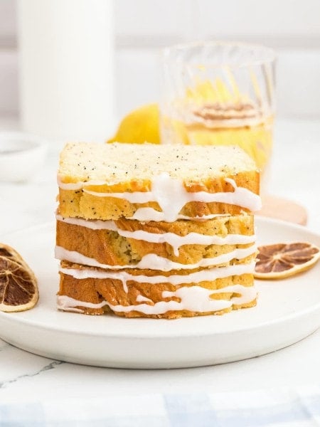 A slice of Lemon Poppy Seed Loaf on a plate.