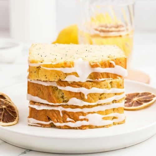 A slice of Lemon Poppy Seed Loaf on a plate.