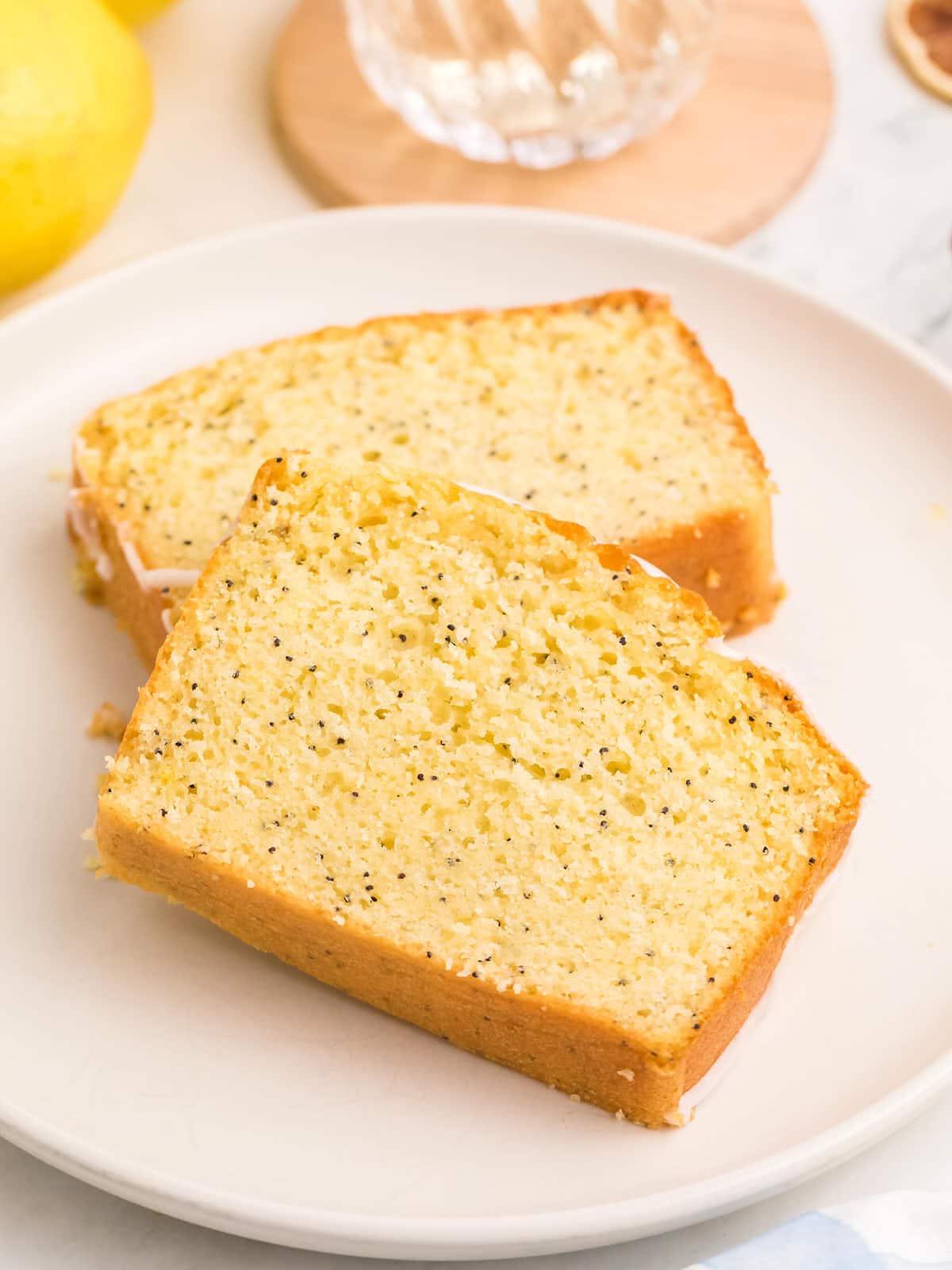 Lemon poppy seed bread on a white plate.