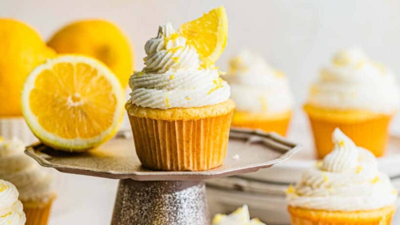 A cupcake with lemon slices on top.